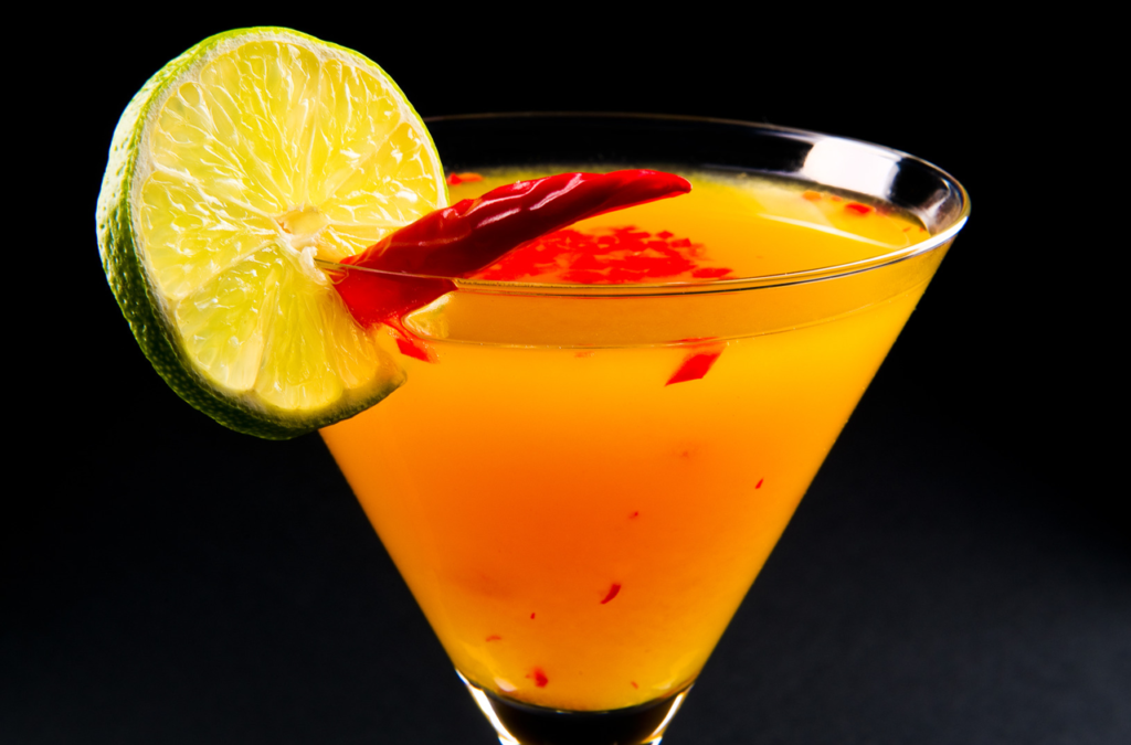 Brandtini orange brand color association with orange cocktail and lime