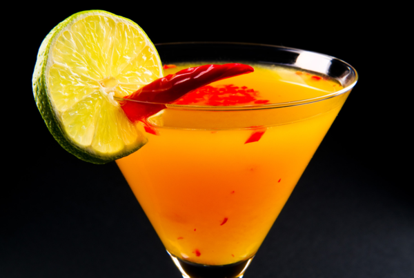 Brandtini orange brand color association with orange cocktail and lime